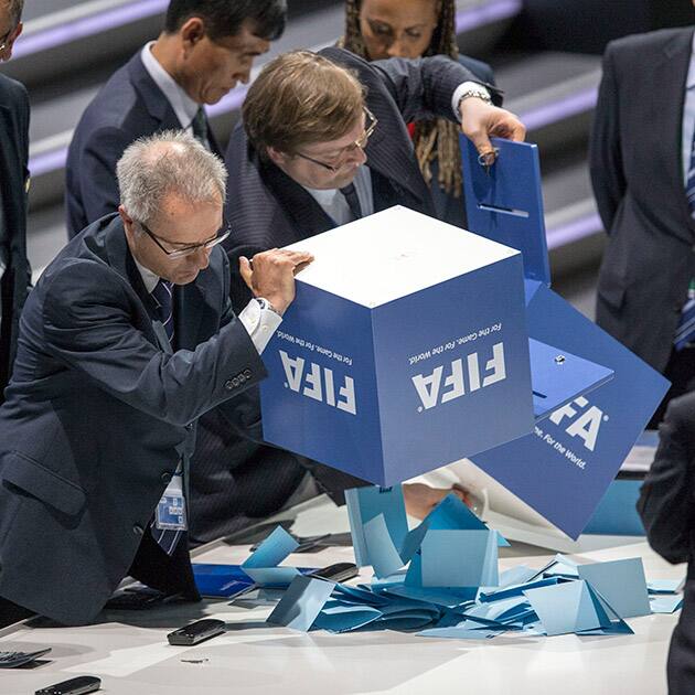 Two notaries empty ballot boxes full of ballot papers after the president's election between candidates Prince Ali bin al-Hussein of Jordan and current FIFA president Joseph S. Blatter of Switzerland during the 65th FIFA Congress held at the Hallenstadion in Zurich, Switzerland.