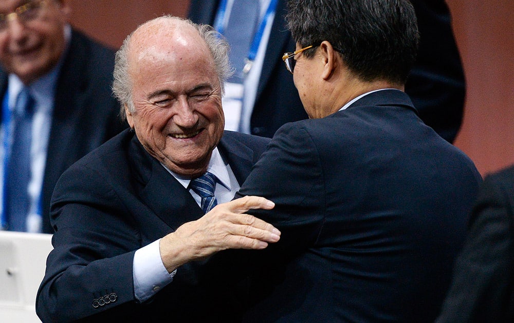 FIFA president Sepp Blatter is greeted after his re-election during the 65th FIFA Congress held at the Hallenstadion in Zurich, Switzerland.