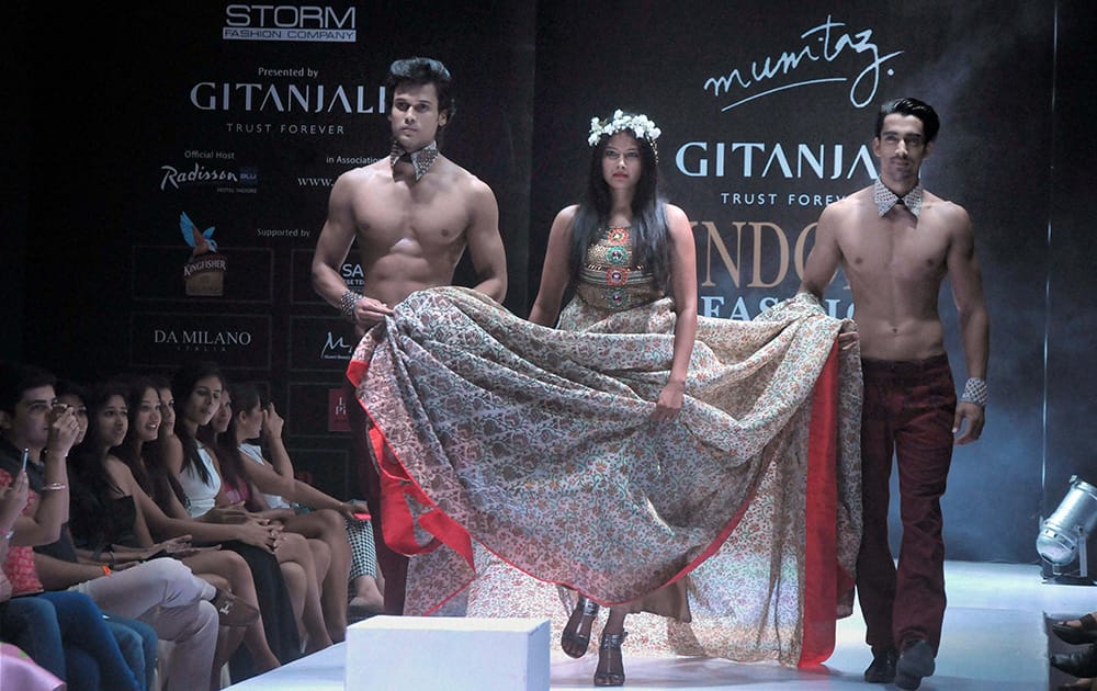 Models walk the ramp at Indore Fashion Week in Indore.