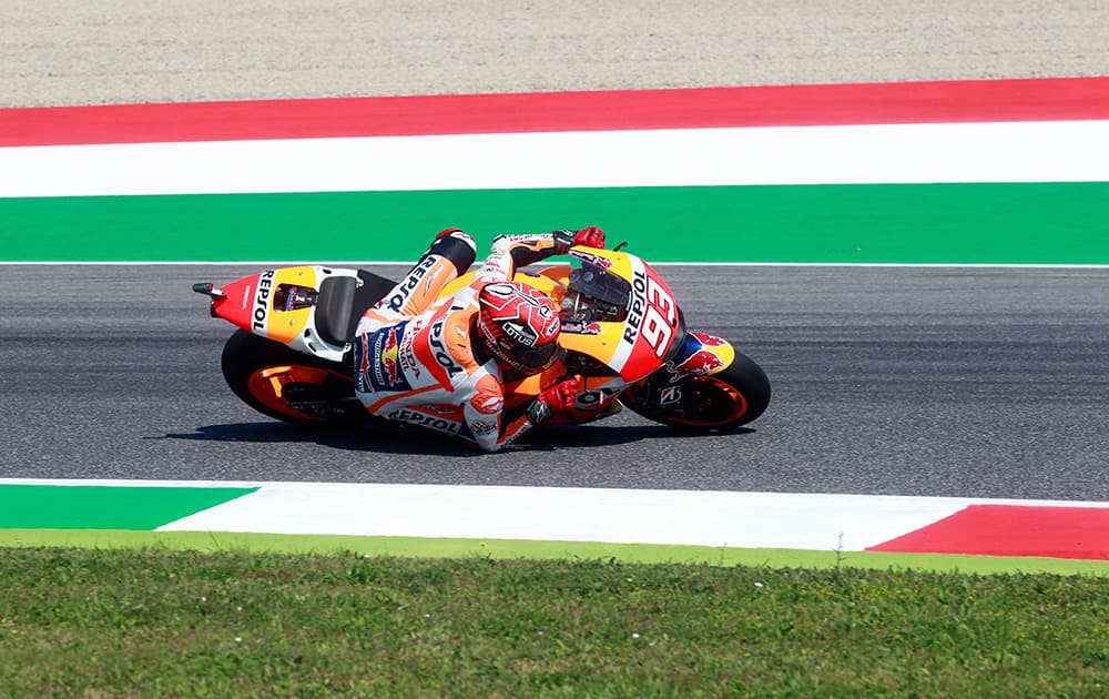 Honda's rider Marc Marquez takes a curve during the Italian MotoGP free practice, at the Mugello race circuit, in Scarperia, Italy.
