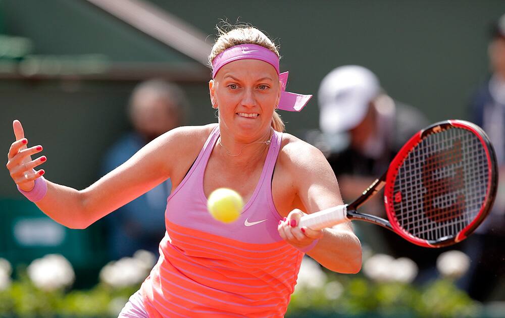 Petra Kvitova of the Czech Republic returns the ball to Romania's Irina-Camelia Begu during their third round match of the French Open tennis tournament at the Roland Garros stadium.