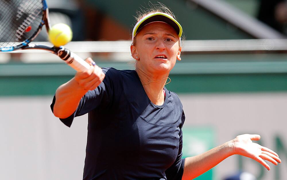 Romania's Irina-Camelia Begu returns the ball to Petra Kvitova of the Czech Republic during their third round match of the French Open tennis tournament at the Roland Garros stadium.