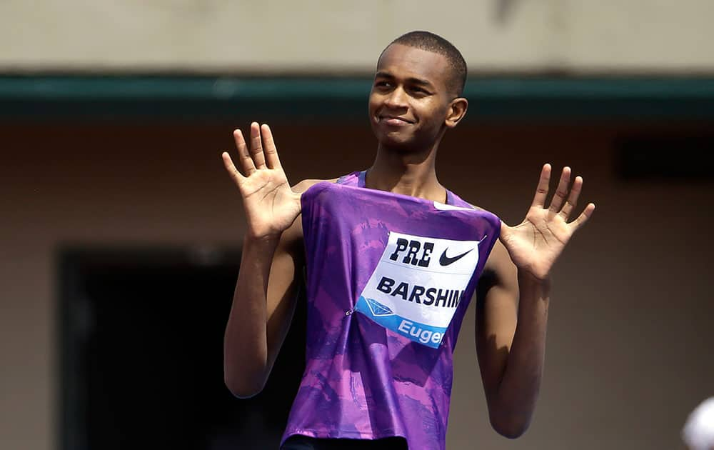 Mutaz Essa Barshim, from Qatar, celebrates after clearing the bar on his way to winning the high jump during the Prefontaine Classic track and field meet in Eugene, Ore.