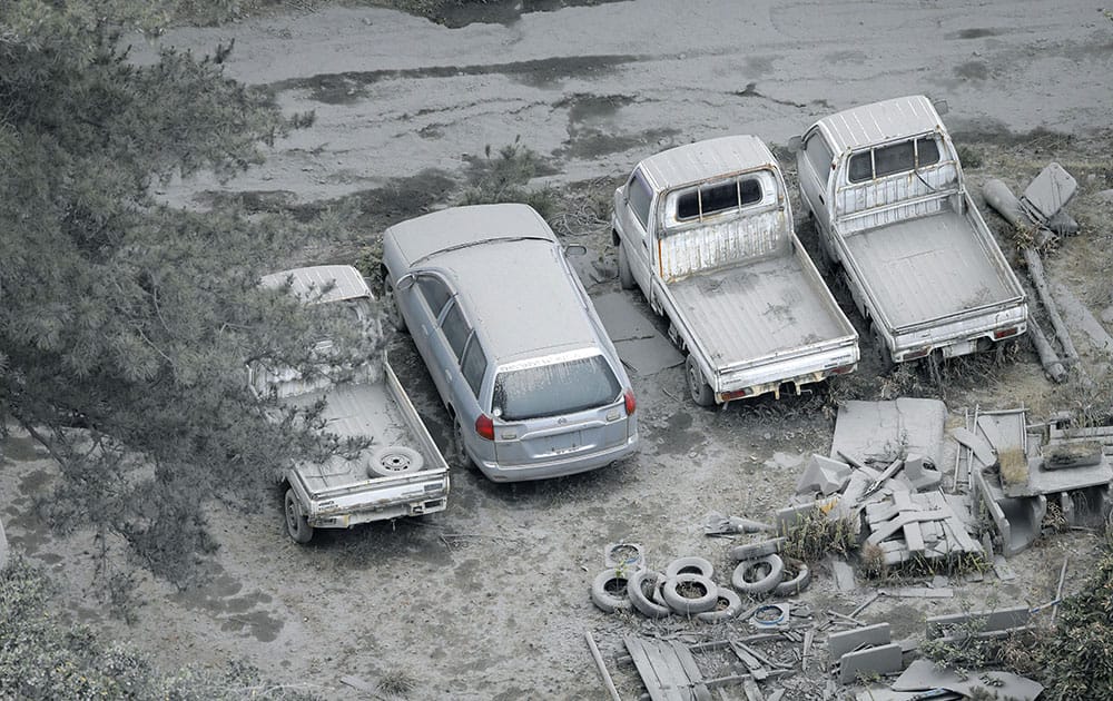 Vehicles are covered with volcanic ash after Friday's eruption of Mount Shindake on Kuchinoerabu island, southern Japan.