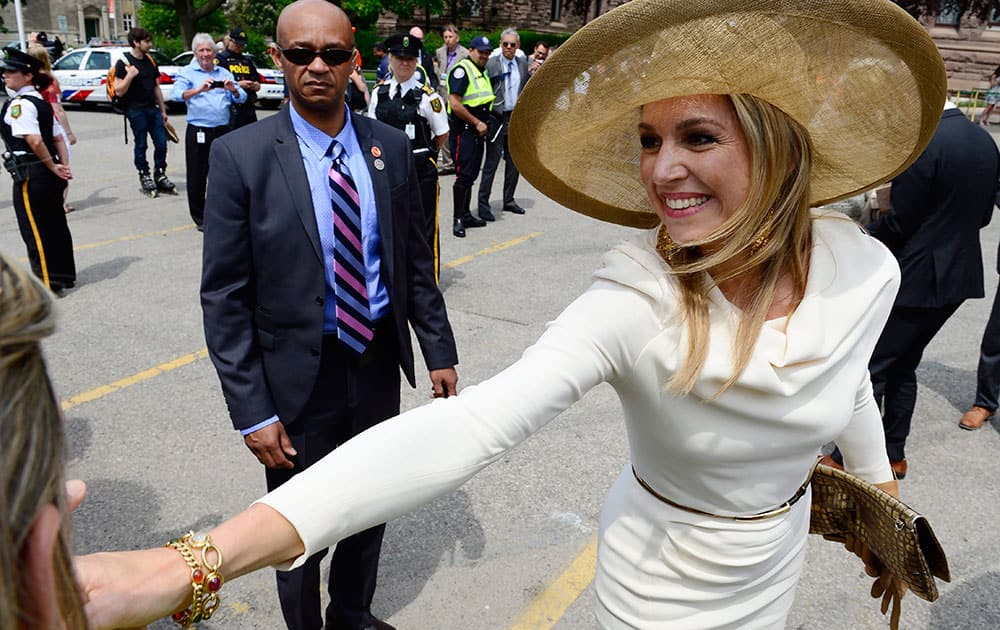 Queen Maxima of the Netherlands greets supporters as she visits Queen's Park, the Ontario Legislature, in Toronto.