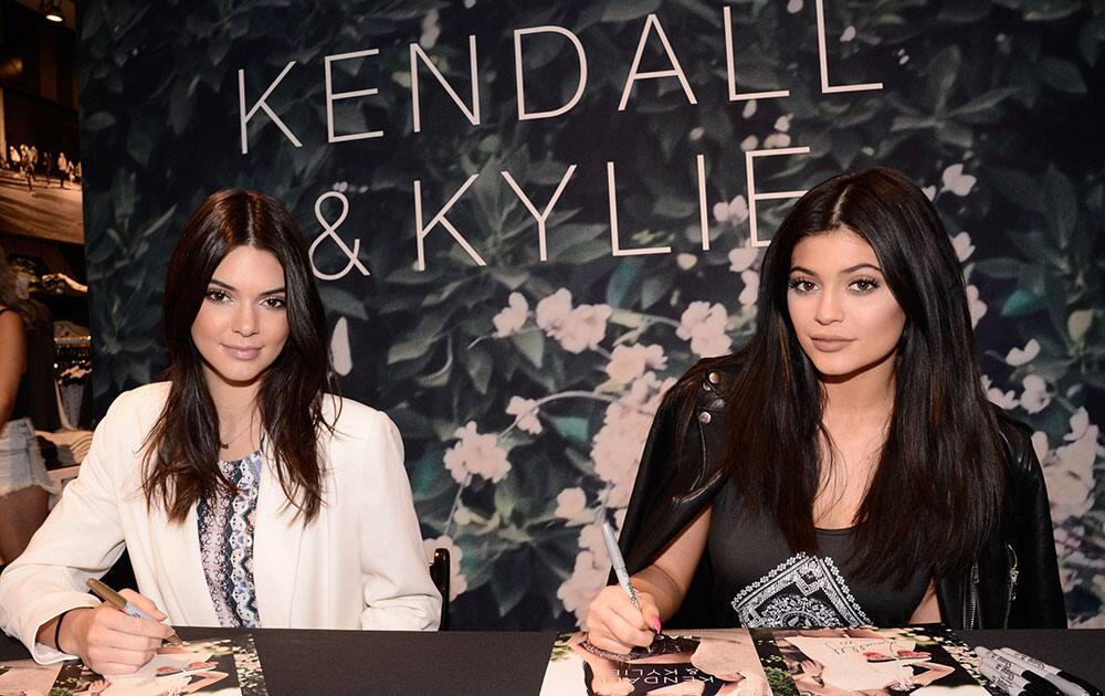 Kendall Jenner, left, and Kylie Jenner make an in-store appearance for their exclusive Summer Collection at the PacSun store, in Santa Monica, Calif.