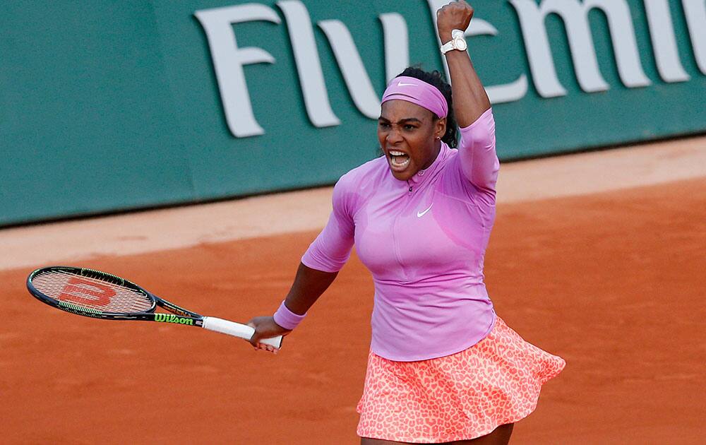 Serena Williams of the U.S. celebrates winning her the third round match of the French Open tennis tournament in three sets 3-6, 6-4, 6-2, against Victoria Azarenka of Belarus at the Roland Garros stadium.