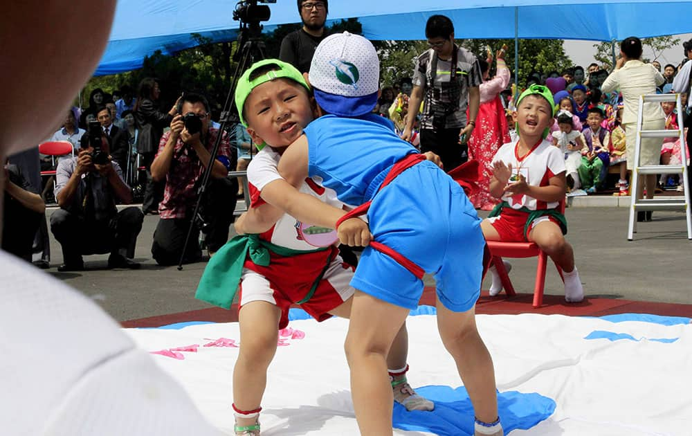 North Korean boys play the Korean wrestling during an International Children’s Day event at an orphanage in Pyongyang, North Korea.