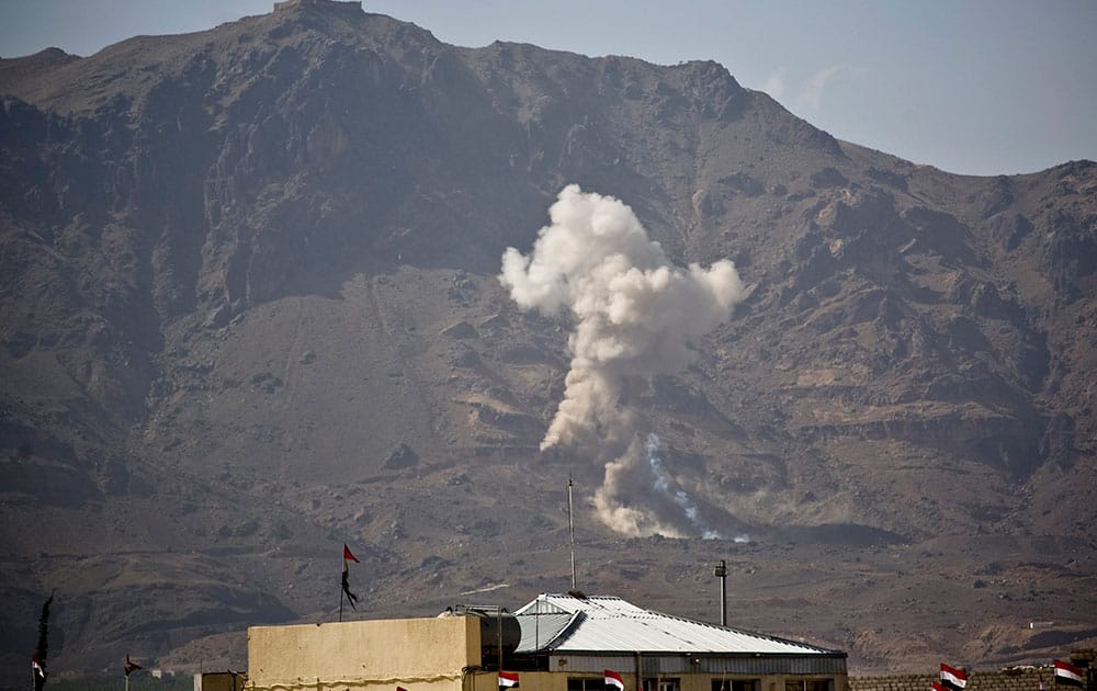 Smoke rises after a Saudi-led airstrike hit a site believed to be one of the largest weapons depot on the outskirts of Yemen's capital, Sanaa.