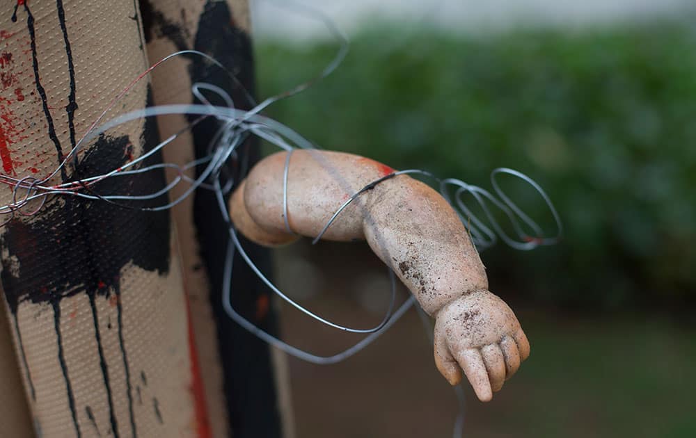 The arm of a doll is part of a sculpture made from trash, on display at the Rio de Janeiro Federal University at an exhibit titled “The Sea Isn’t Made for Fish” in Rio de Janeiro, Brazil.