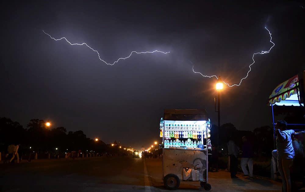 New Delhi: A view of lightning over Rajpath during rains.