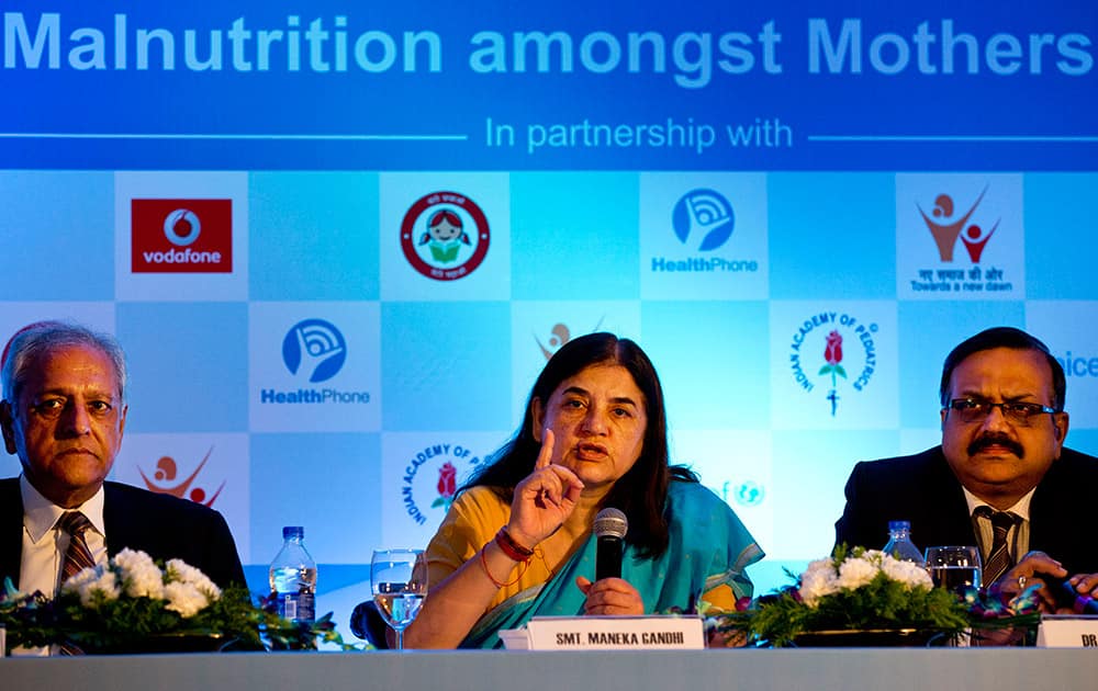 Women and Child Development Minister Maneka Gandhi, Nand Wadhwa, founder of HealthPhone and S.S Kamath, President of Indian Academy of Pediatrics, attend the launch of a mobile education program for mothers in New Delhi.