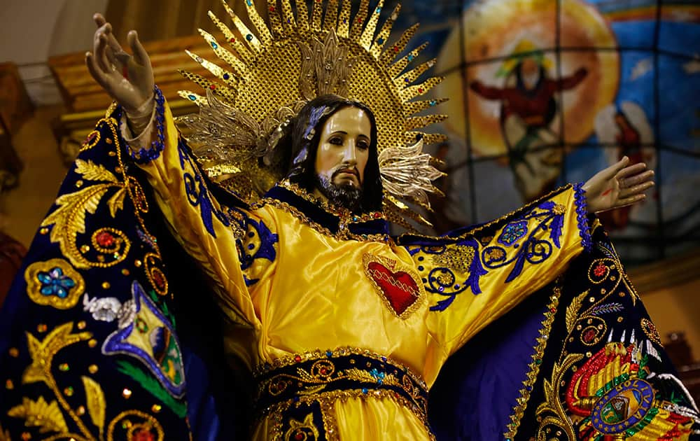 Devotees prepare a statue of 