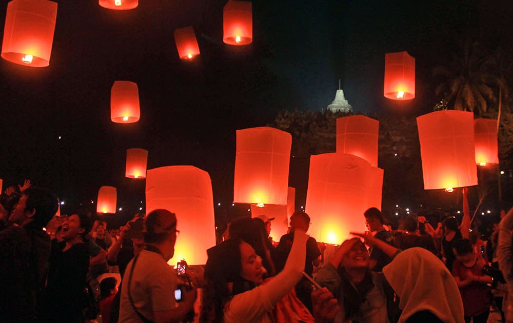 Indonesian Buddhists release lanterns near Borobudur Temple, the world's largest Buddhist monument, during a Vesak Day procession in Magelang, Central Java, early. Vesak is the day that marks the birth, death and enlightenment of Buddha. 