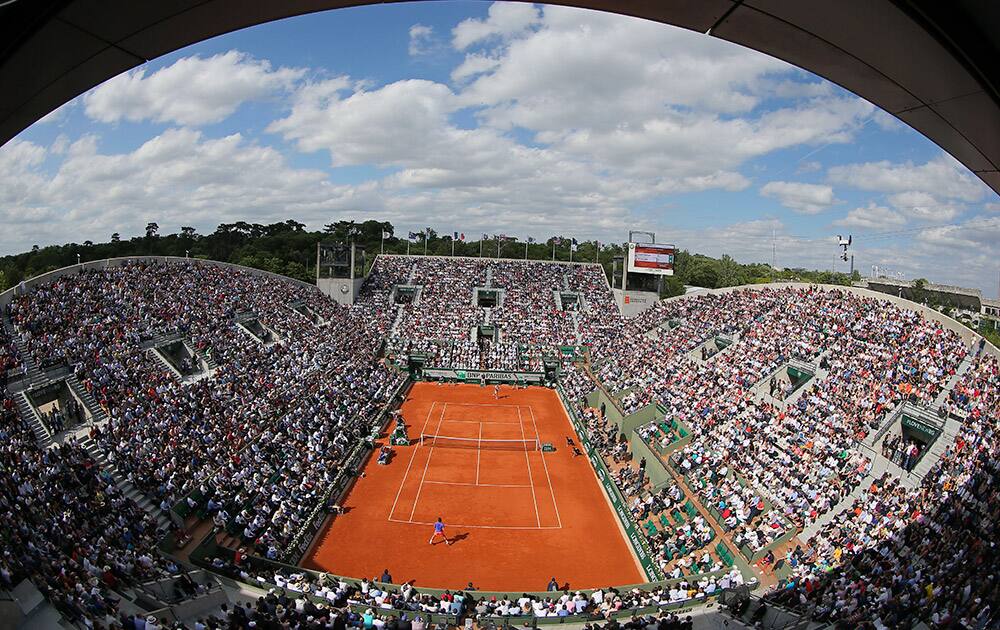 Switzerland's Roger Federer plays the quarterfinal match of the French Open tennis tournament against Switzerland's Stan Wawrinka on Suzanne Leglen court at the Roland Garros stadium, in Paris, France.