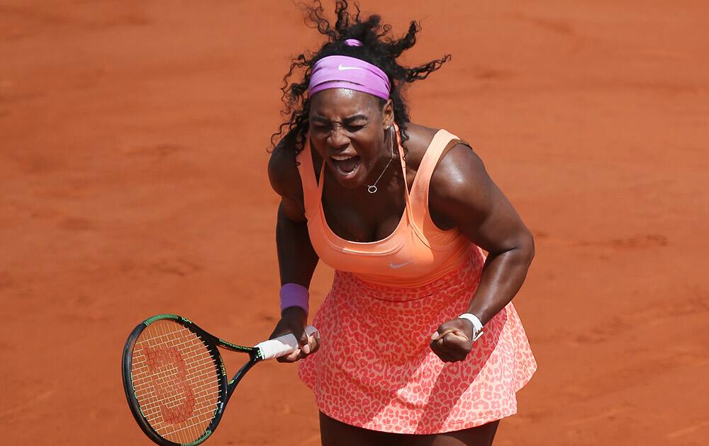 Serena Williams of the US celebrates winning the quarterfinal match of the French Open tennis tournament against Italy's Sara Errani in two sets 6-1, 6-3, at the Roland Garros stadium, in Paris, France.