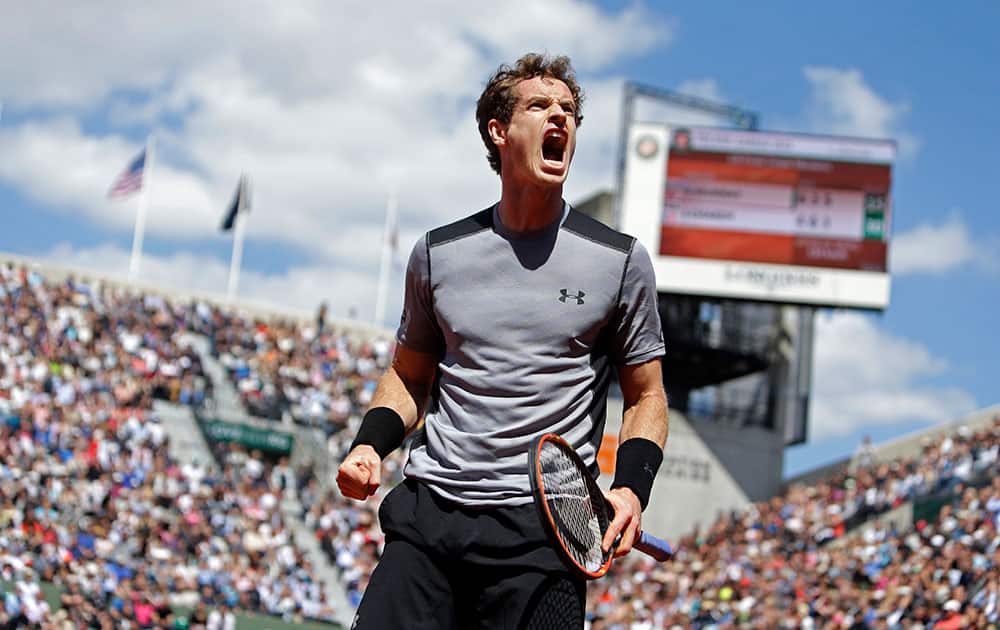 Britain's Andy Murray clenches his fist after scoring a point in the fourth round match of the French Open tennis tournament against France's Jeremy Chardy at the Roland Garros stadium.