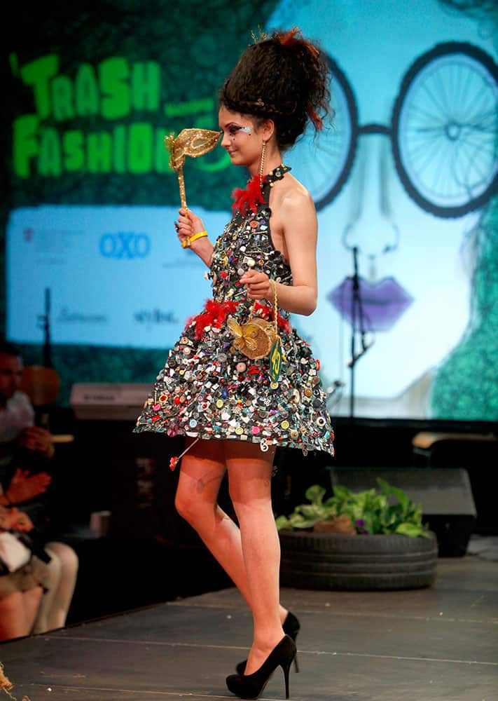 A model presents a creation made of hundreds of buttons during Trash Fashion Show in Macedonia's capital Skopje.