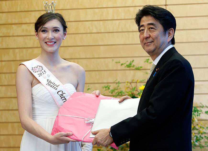 US Cherry Blossom Queen 2015 Noelle Verhelst meets with Japan's Prime Minister Shinzo Abe at Abe's official residence in Tokyo.