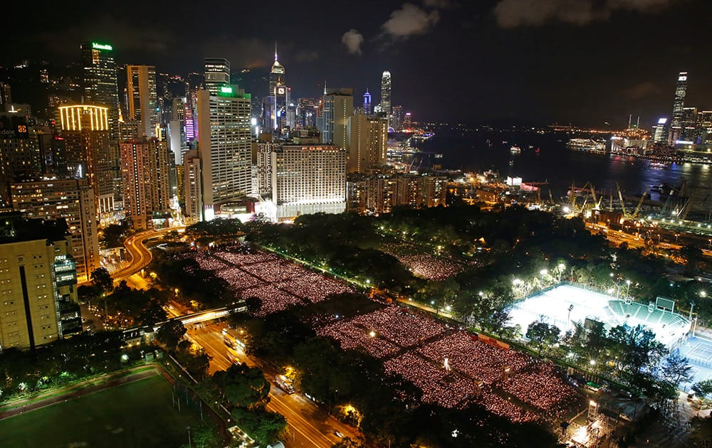 Tens of thousands of people attend a candlelight vigil at Victoria Park in Hong Kong. Hong Kongers held a candlelight vigil Thursday night to mark the suppression of the 1989 student-led Tiananmen Square protests, an annual event that takes on greater meaning for the city's youth after last autumn's pro-democracy demonstrations sharpened their sense of unease with Beijing.