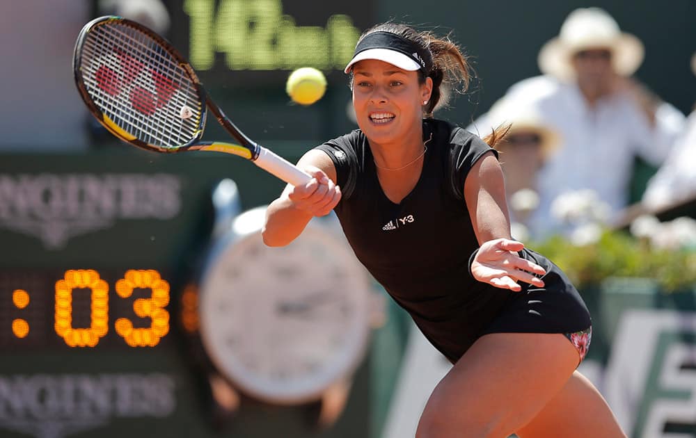 Serbia's Ana Ivanovic returns in the semifinal match of the French Open tennis tournament against Lucie Safarova of the Czech Republic at the Roland Garros stadium, in Paris, France.