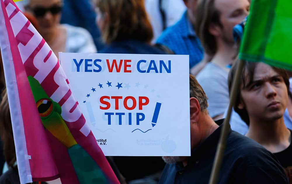 Demonstrators hold a sign against the TTIP contract during a protest against the upcoming G-7 in Munich, southern Germany.