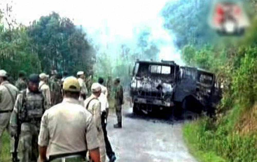 A scene after a military convoy was attacked by an unidentified insurgent outfit first with a powerful Improvised Explosive Device (IED) killing at least 18 army personnel and injuring 11 others in Manipurs Chandel district.