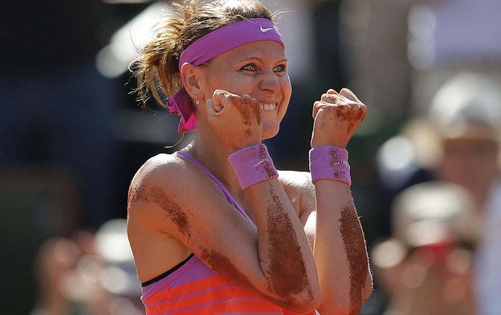 Lucie Safarova of the Czech Republic celebrates winning her semifinal match of the French Open tennis tournament against Serbias Ana Ivanovic in two sets, 7-5, 7-5, at the Roland Garros stadium, in Paris, France.