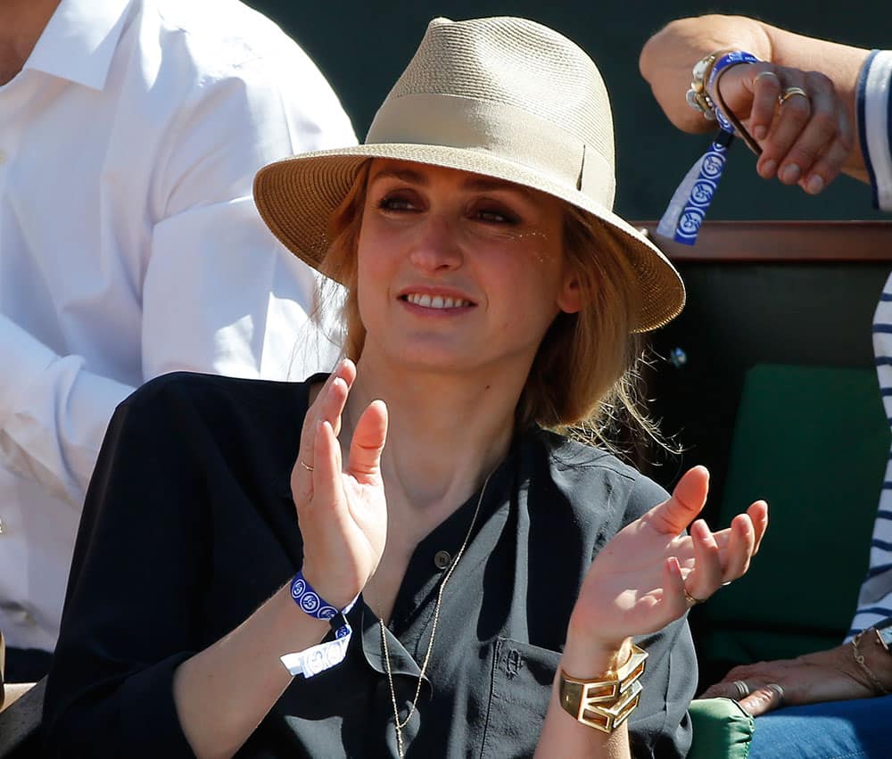 French actress Julie Gayet applauds while Lucie Safarova of the Czech Republic plays Serbia's Ana Ivanovic during their semifinal match of the French Open tennis tournament.