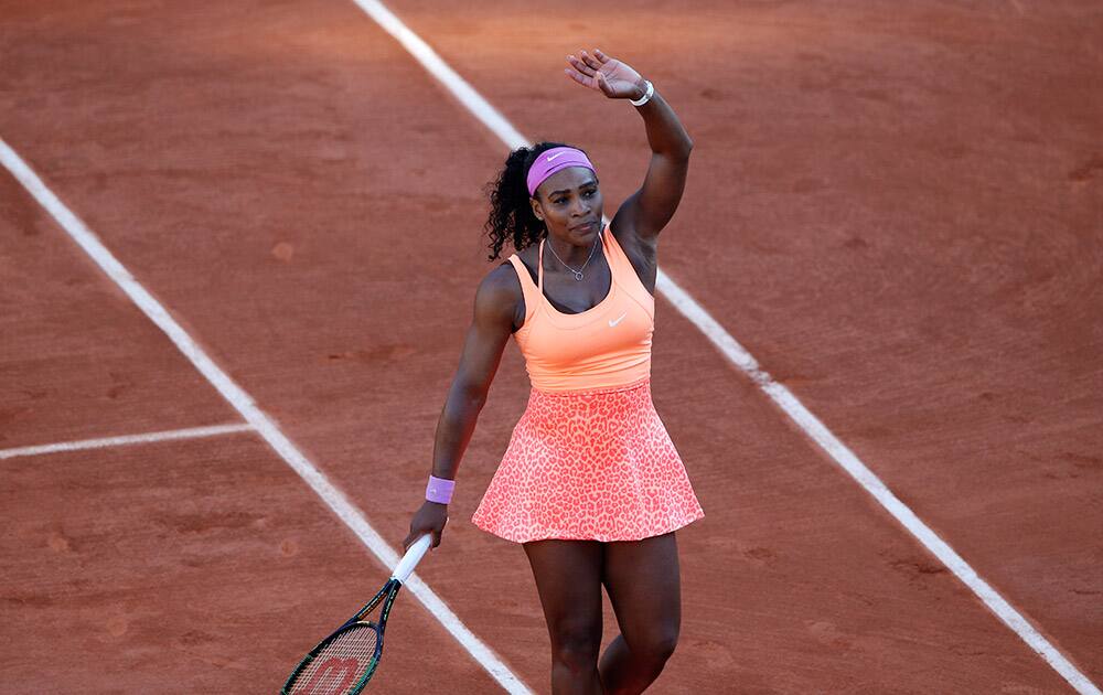 Serena Williams of the US celebrates winning her semifinal match of the French Open tennis tournament against Timea Bacsinszky of Switzerland in three sets 4-6, 6-3, 6-0, at the Roland Garros stadium, in Paris, France.