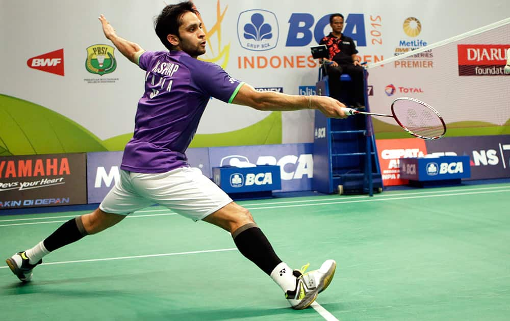 India's Parupalli Kashyap returns the shuttlecock to China's Chen Long during their men singles quarter final match at the Indonesia Open badminton tournament at Istora Stadium in Jakarta, Indonesia.