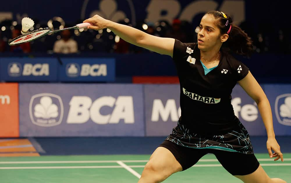 Saina Nehwal returns the shuttlecock to China's Wang Shixian during their women's singles quarterfinal match at the Indonesia Open badminton tournament at Istora Stadium in Jakarta, Indonesia.