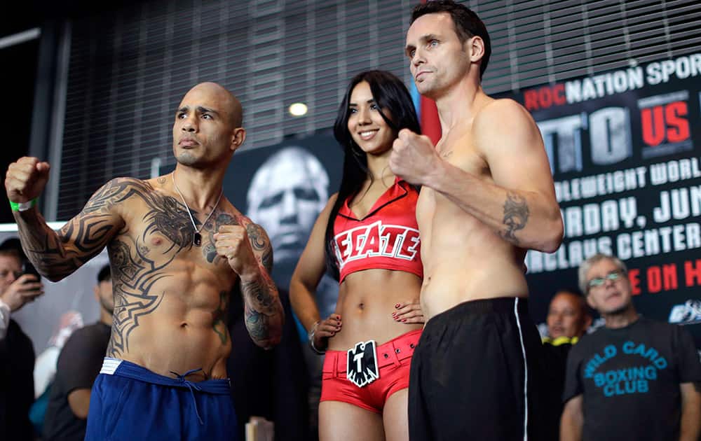 Boxers Daniel Geale and Miguel Cotto pose for photographers during the weigh-in for their fight at the Barclays Center in the Brooklyn borough of New York. Cotto is slated to defend his WBC world middleweight title against Geale on Saturday.