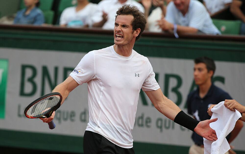 Britain's Andy Murray shouts in his semifinal match of the French Open tennis tournament against Serbia's Novak Djokovic at the Roland Garros stadium, in Paris, France.
