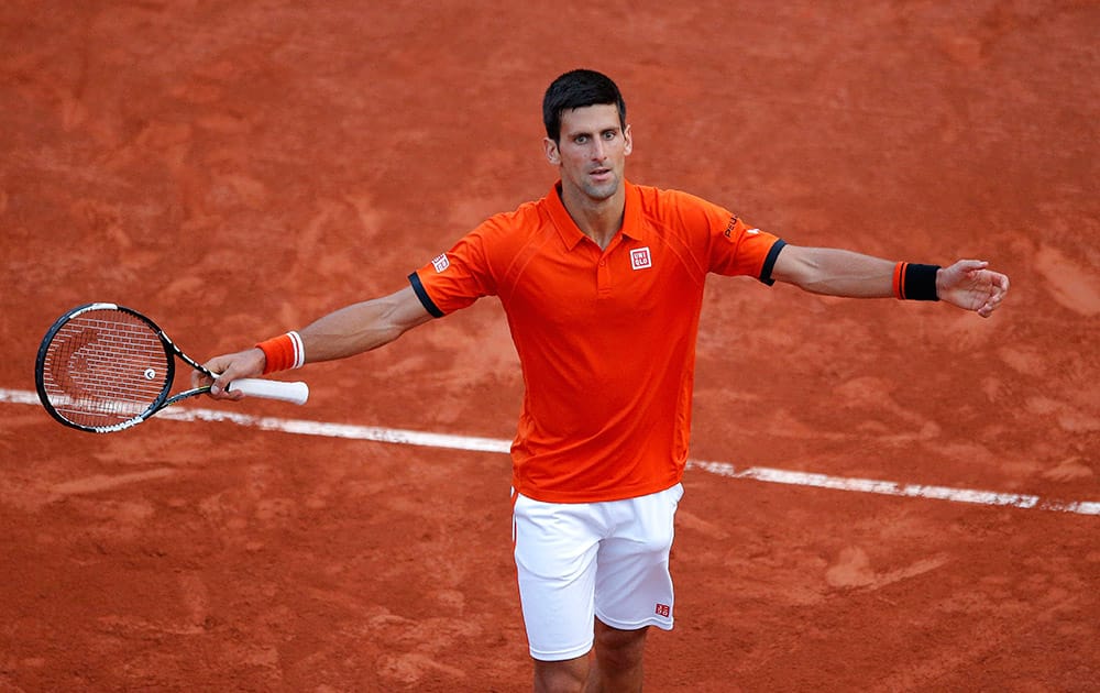 Serbia's Novak Djokovic reacts as he plays Britain's Andy Murray during their semifinal match of the French Open tennis tournament at the Roland Garros stadium in Paris, France.