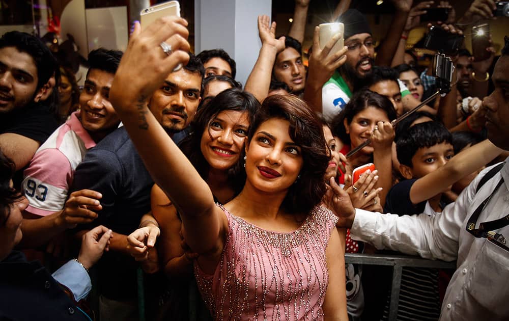 Priyanka Chopra has a selfie photo taken with fans during the IIFA Gala Screening as part of the three-day long International Indian Film Academy (IIFA) awards held in Kuala Lumpur, Malaysia.