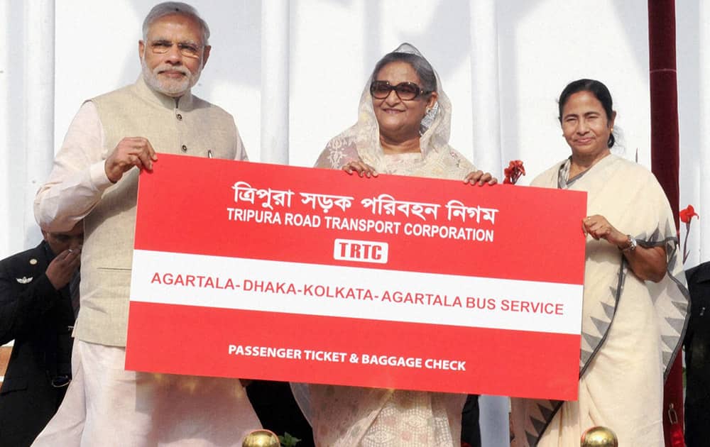 Prime Minister Narendra Modi, his Bangladeshi counterpart Sheikh Hasina and West Bengal Chief Minister Mamata Banerjee at the flag off ceremony of bus services between Bangladesh and India, in Dhaka.