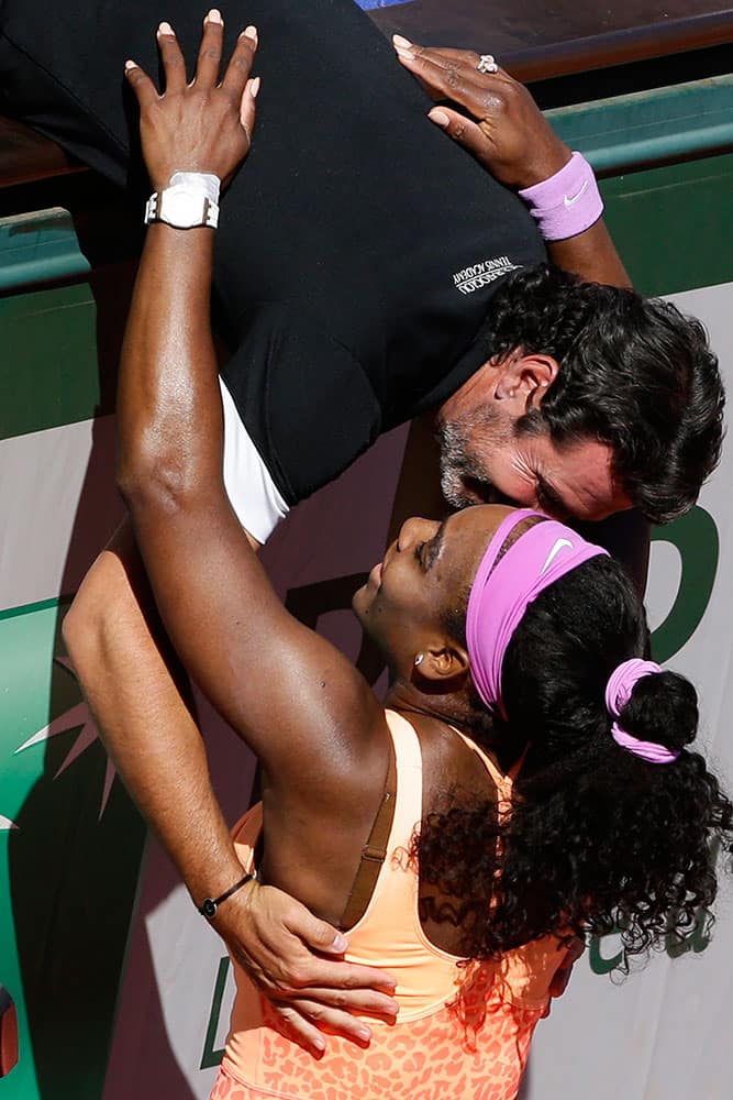 Serena Williams of the U.S. hugs her coach Patrick Mouratoglou of France after winning the final of the French Open tennis tournament against Lucie Safarova of the Czech Republic in three sets, 6-3, 6-7, 6-2, at the Roland Garros stadium.