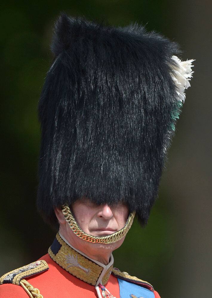 Britain's Prince Charles The Prince of Wales, as Colonel of Welsh Guards, leads the Welsh Guards during The Colonel's Review procession from Buckingham Palace to Horse Guards Parade in London.