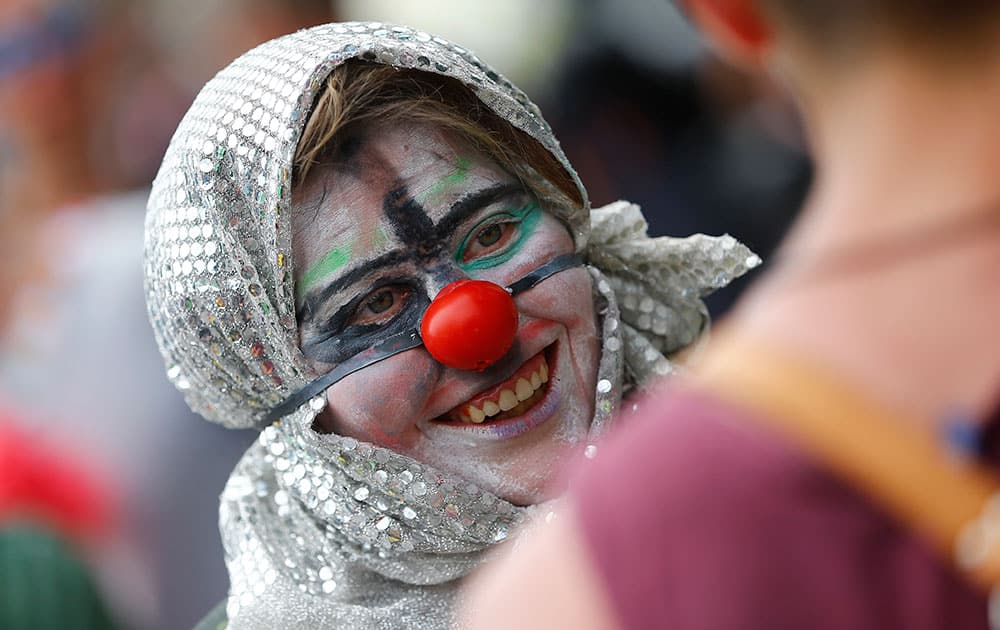 A protestor dressed as clown smiles during a protest in Garmisch-Partenkirchen, southern Germany,  against the G-7 summit in nearby Schloss Elmau hotel.