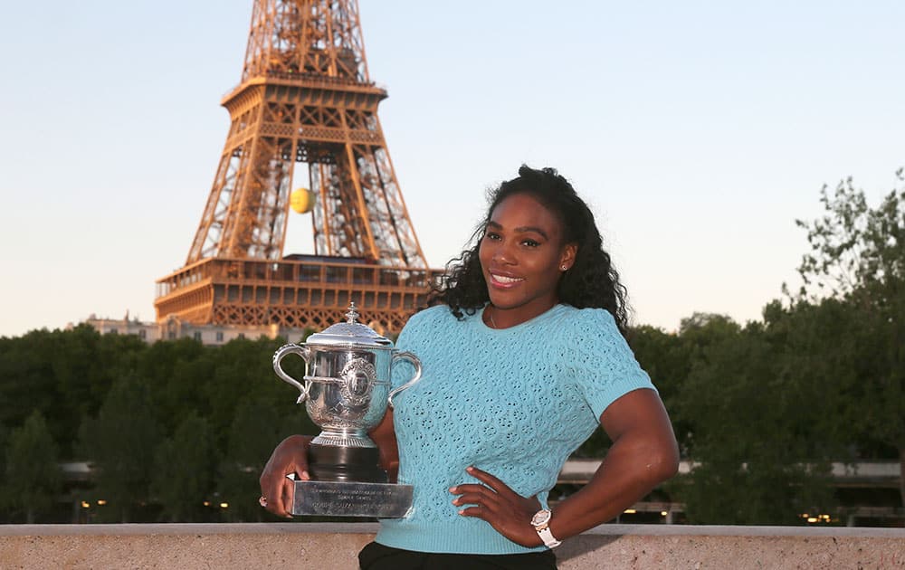 Serena Williams of the U.S. poses with her trophy after defeating Lucie Safarova of the Czech Republic in three sets, 6-3, 6-7, 6-2, in the women's final of the French Open tennis tournament, at Roland Garros stadium in Paris.