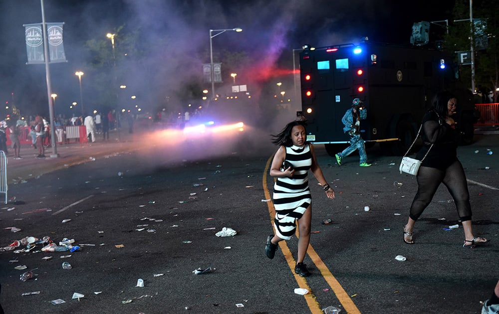 State Police respond to disturbances outside the MetLife Stadium where Summer Jam Hot 97 concert was held in East Rutherford, N.J.