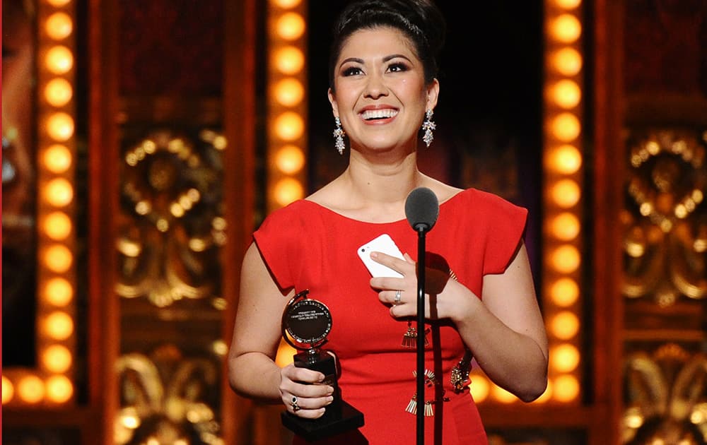 Ruthie Ann Miles accepts the award for best performance by an actress in a featured role in a musical for 'The King & I' at the 69th annual Tony Awards at Radio City Music Hall, in New York.