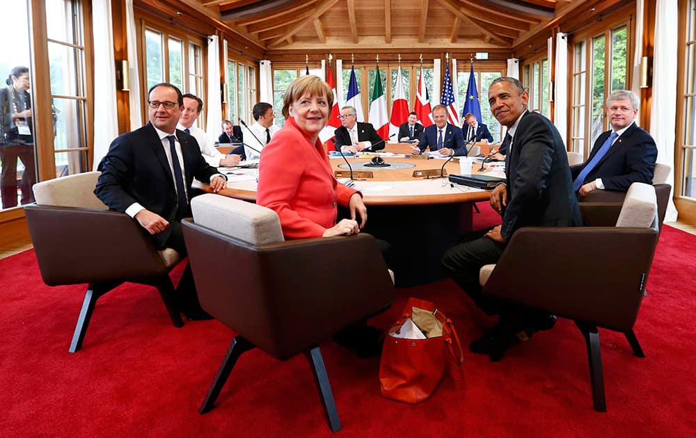 French President Francois Hollande, British Prime Minister David Cameron, Italian Prime Minister Matteo Renzi, German Chancellor Angela Merkel, European Commission President Jean-Claude Juncker, European Council President Donald Tusk, US President Barack Obama and Canadian Prime Minister Stephen Harper, from left, before a working meeting at the G-7 summit at Schloss Elmau hotel near Garmisch-Partenkirchen, southern Germany.