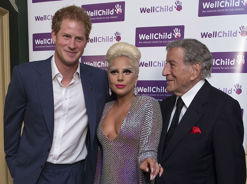 Britain's Prince Harry, left, meets with Lady Gaga and Tony Bennett, right, as they attend a Well Child Charity concert at the Royal Albert Hall in London.
