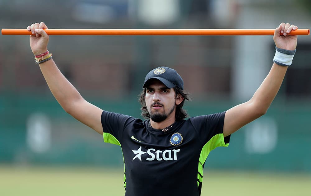 Ishant Sharma stretches during a practice session ahead of their test cricket match against Bangladesh in Dhaka, Bangladesh.