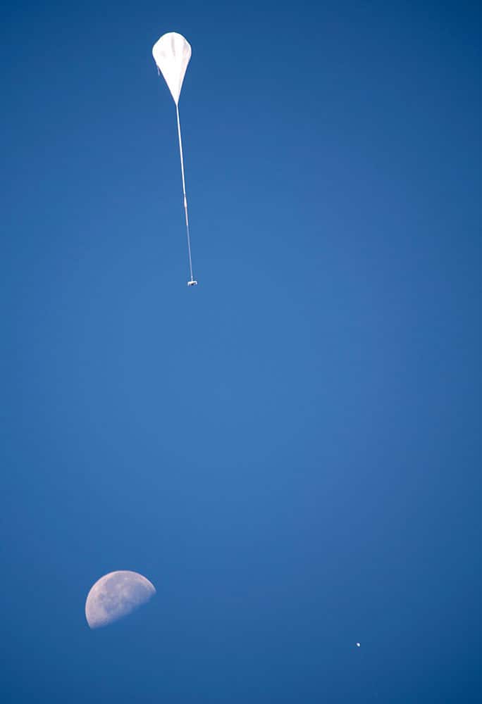 the test vehicle for NASA's low-density supersonic decelerator (LDSD) gains altitude after its launch from U.S. Navy's Pacific Missile Range Facility in Kauai, Hawaii. The parachute inflated during the test of new technology for landing larger spacecraft on Mars, but it then disintegrated immediately afterward, NASA officials said Tuesday, June 9.