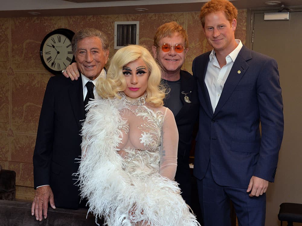 From right, Britain's Prince Harry, Elton John, Lady Gaga and Tony Bennett pose backstage for photographs after Bennett and Lady Gaga's performance as part of the Cheek to Cheek Tour at the Royal Albert Hall in London.