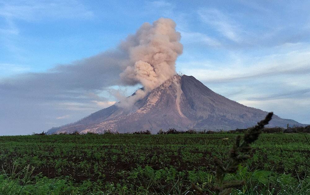 Mount Sinabung spews volcanic materials from its crater in Tanah Karo, North Sumatra, Indonesia.