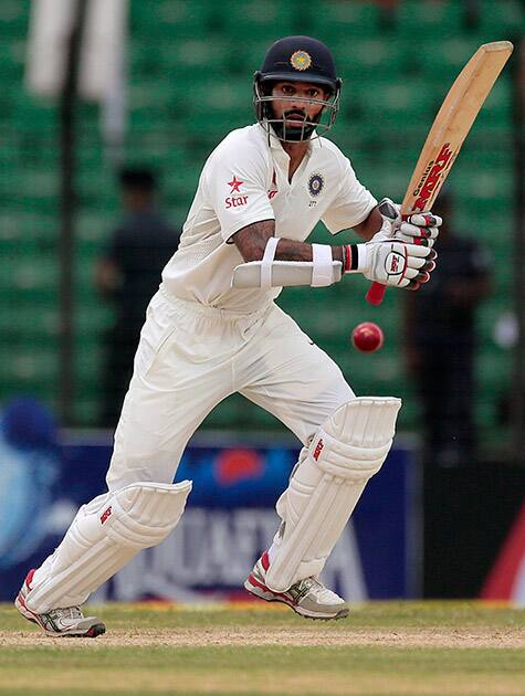 Shikhar Dhawan plays a shot during the first day of their test cricket match against Bangladesh in Fatullah, Bangladesh.